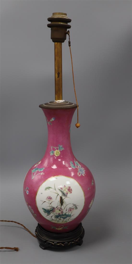A Chinese ruby sgraffito ground vase, mounted as a lamp, Republic period, 36cm high including wood stand and metal rim mount